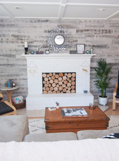The newly painted fireplace in our remodeled living room