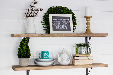 Detail of wooden shelves on the finished shiplap wall