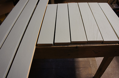 Paint the shelf supports before installing them