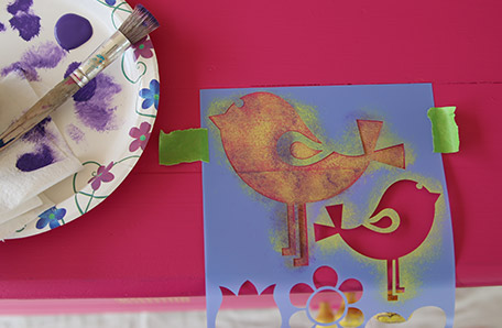 Dab a second, darker color over the stencil to add some depth