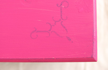 You can still see the old stencil still through the first coat of paint