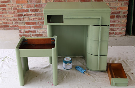 The desk and stool after one coat of paint