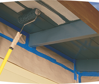Close-up of roller painting under eaves