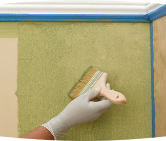 Person splotching on paint with a paint brush